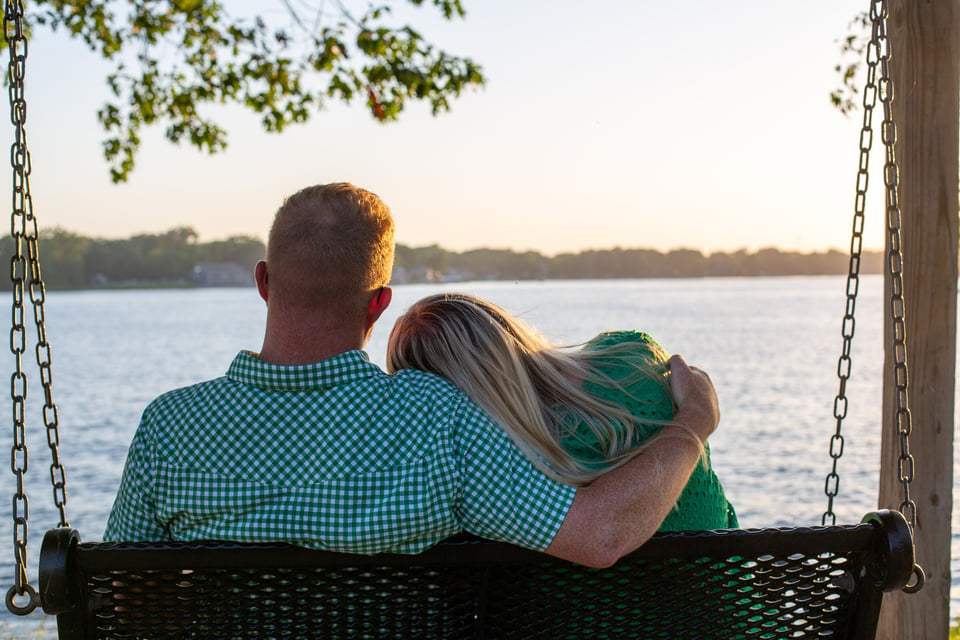 Luke and Lydia sitting together by the reservoir