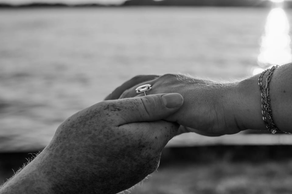 A black-and-white detail of Lydia’s engagement ring